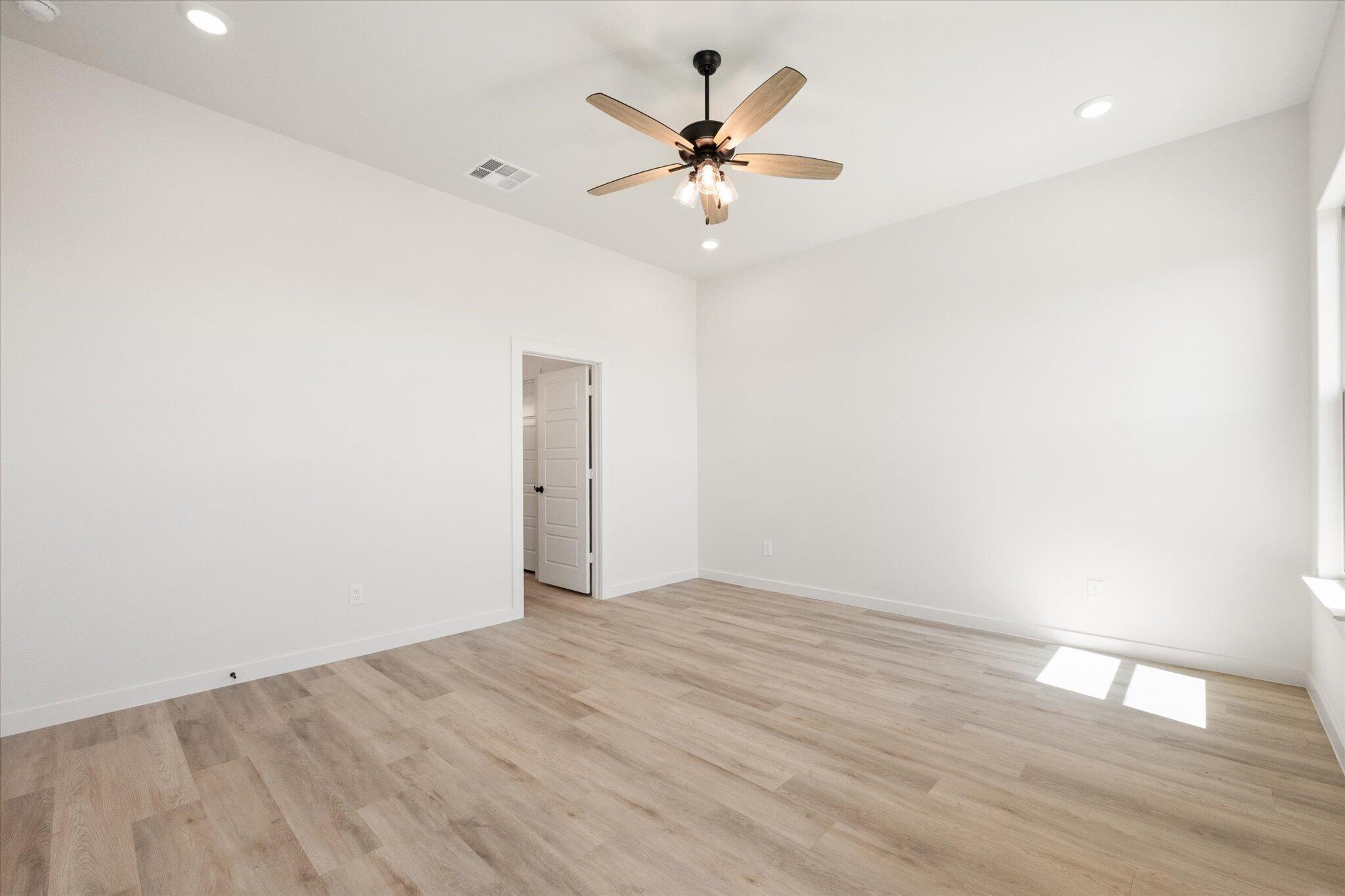 6103 121st Street Lubbock, TX 79424 - Photo 19 of 30 wooden floor in an empty room