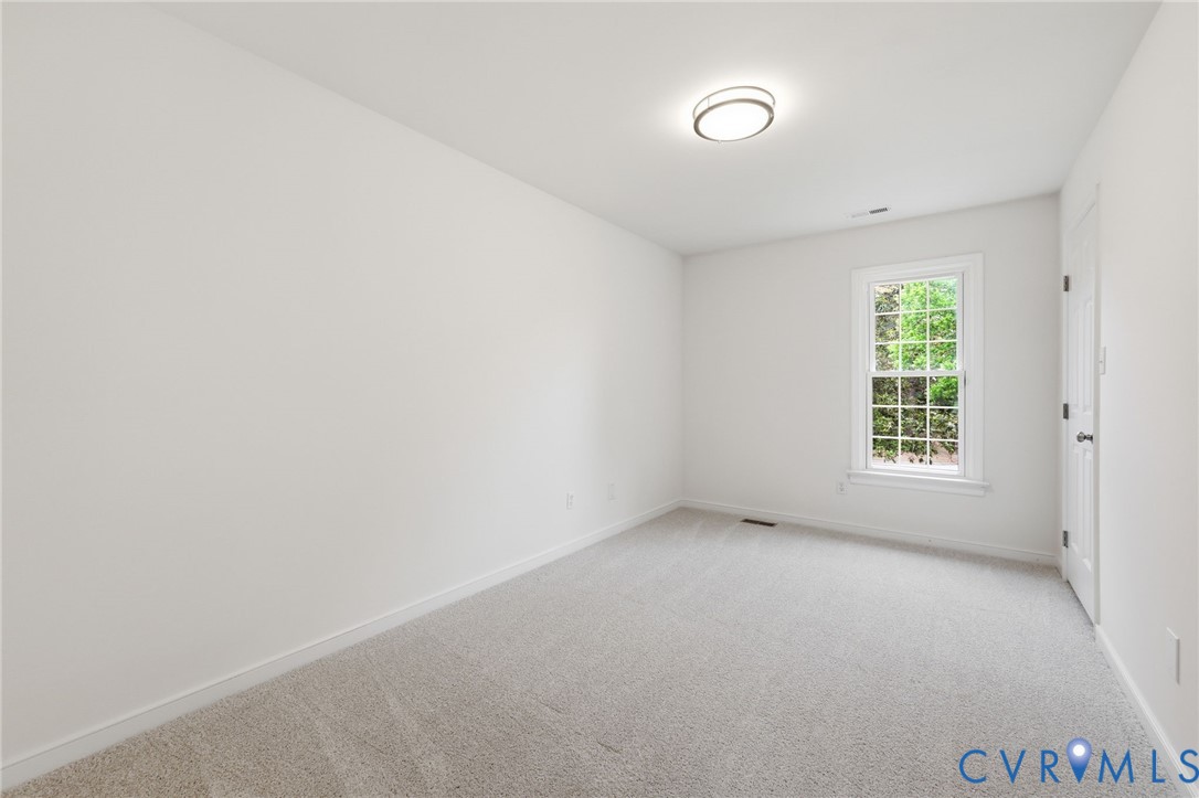 12111 Auger Lane Midlothian, VA 23113 - Photo 19 of 31 a view of an empty room with a window