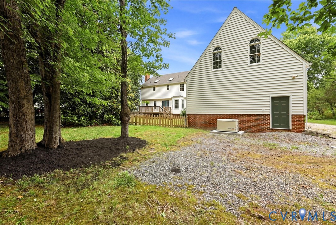12111 Auger Lane Midlothian, VA 23113 - Photo 2 of 31 a view of a house with backyard and trees
