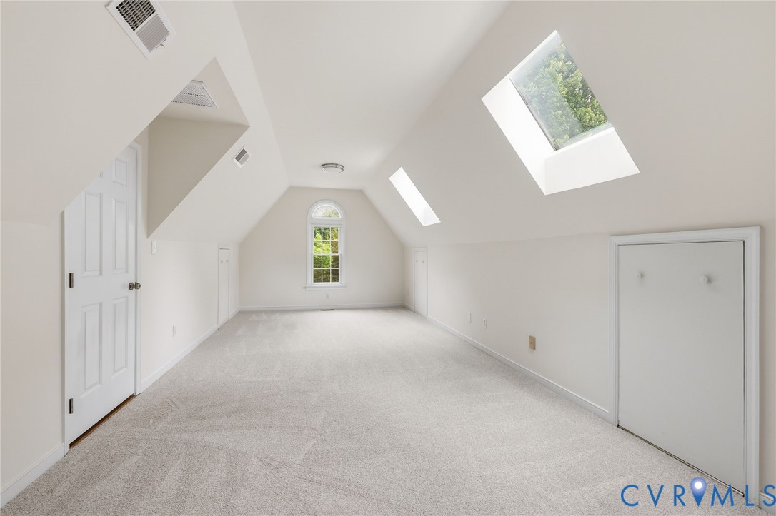 12111 Auger Lane Midlothian, VA 23113 - Photo 24 of 31 an empty room with windows and cabinet