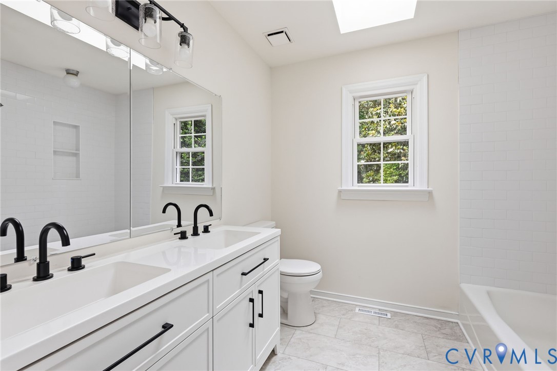 12111 Auger Lane Midlothian, VA 23113 - Photo 26 of 31 a bathroom with a sink and a mirror