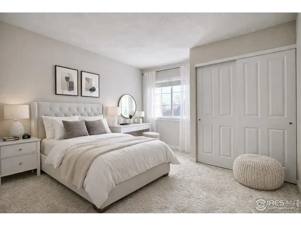 a bedroom with a bed and a painting