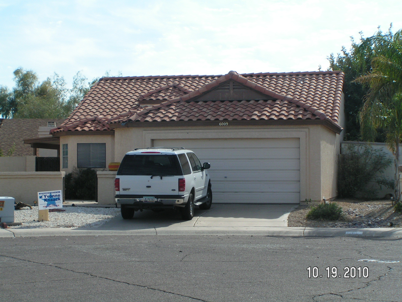 6009 West Shangri-la Road Glendale, AZ 85304 - Photo 1 of 10 a car parked in front of a house