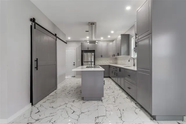 a bathroom with a sink a mirror and shower