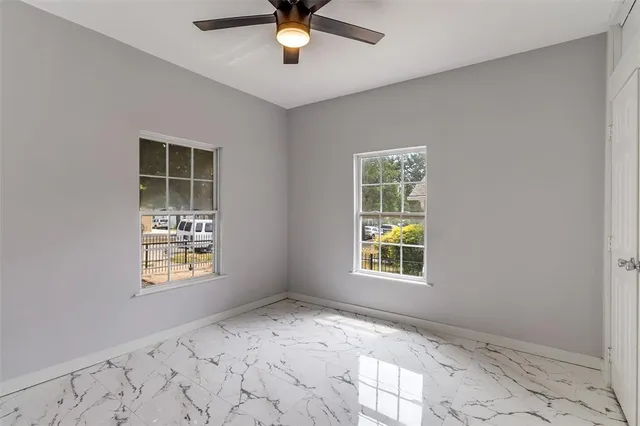 a view of an empty room with a window