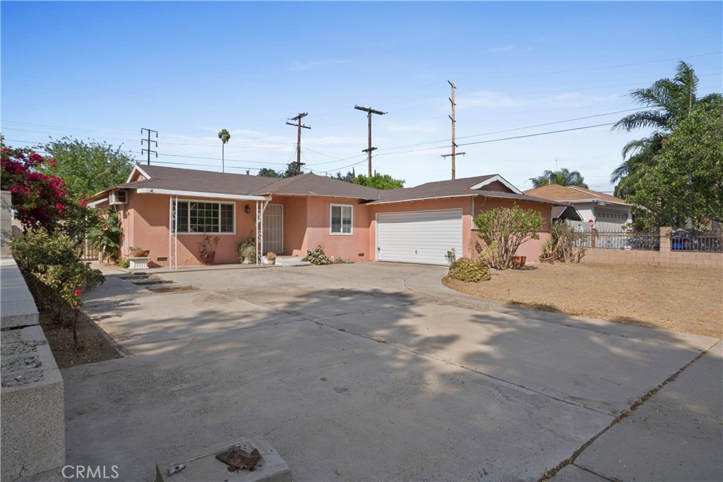 3825 Lofton Place Riverside, CA 92501 - Photo 2 of 20 a front view of a house with a yard