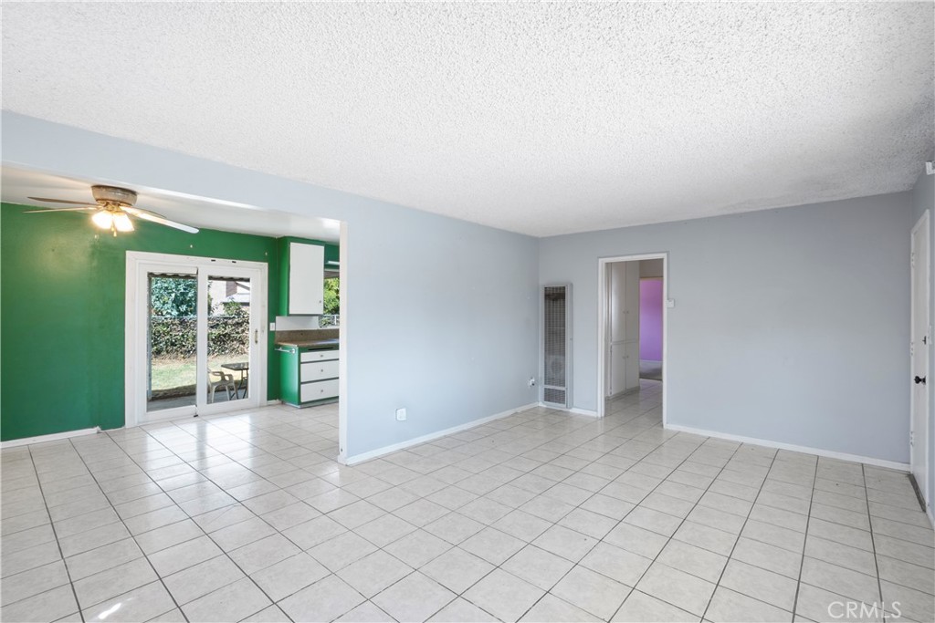 3825 Lofton Place Riverside, CA 92501 - Photo 4 of 20 a view of an empty room with window and cabinet