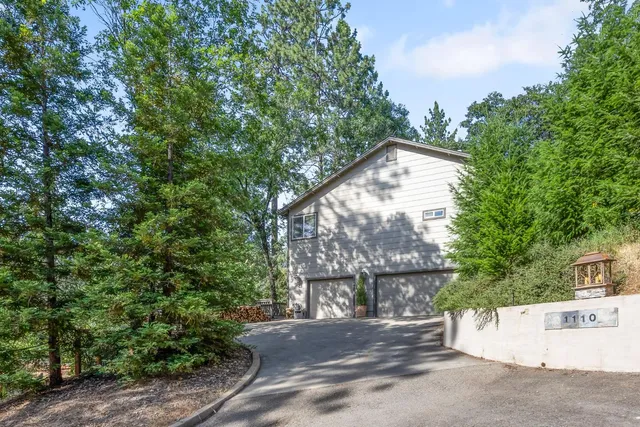 a view of a wooden house with large windows