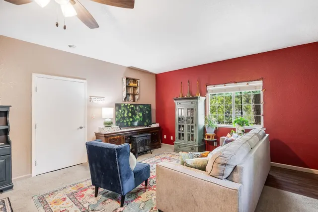 a bath tub sitting in a bathroom next to a window