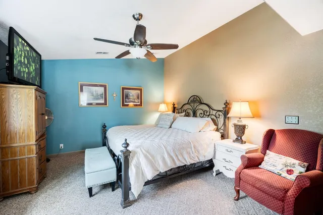 a bedroom with a bed and window