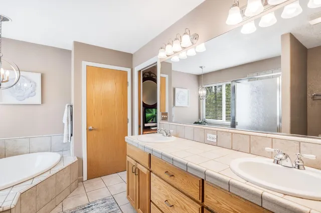 a view of a patio with table and chairs and potted plants