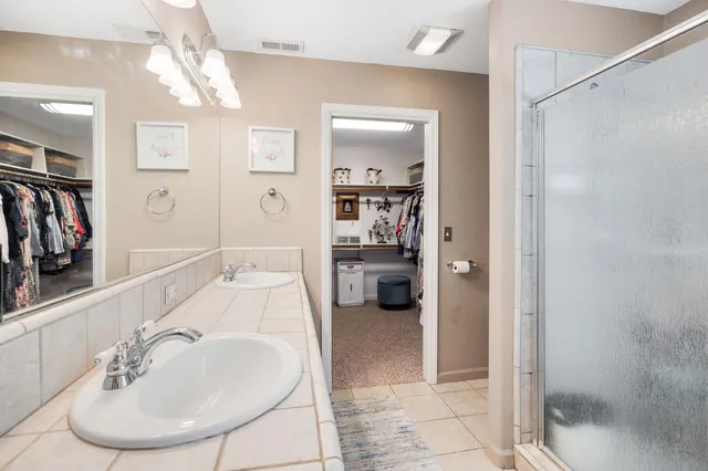 a view of backyard of house with seating area