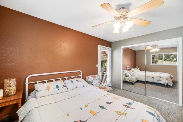 a view of backyard with plants and outdoor seating