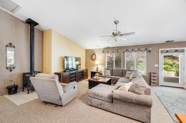 a large kitchen with stainless steel appliances granite countertop a sink and cabinets