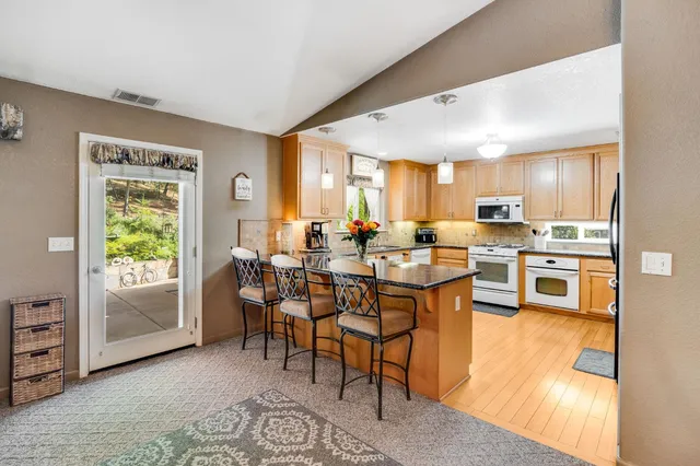 a view of a hallway with entryway closet and front door