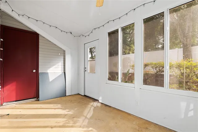a view of an empty room with a window