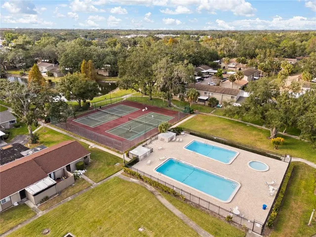 an aerial view of residential houses with outdoor space