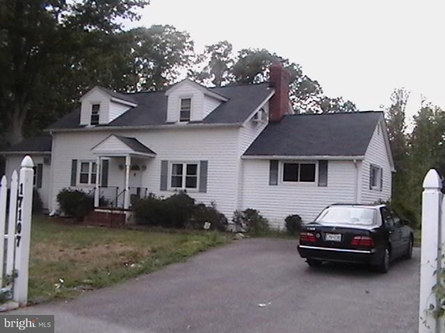 17107 Livingston Road Accokeek, MD 20607 - Photo 2 of 22 a car parked in front of a white house