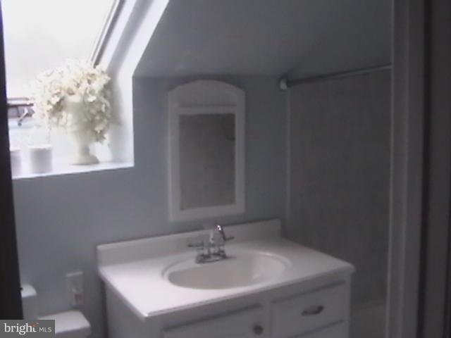 17107 Livingston Road Accokeek, MD 20607 - Photo 12 of 22 a bathroom with a sink and a mirror
