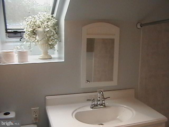 17107 Livingston Road Accokeek, MD 20607 - Photo 13 of 22 a bathroom with a sink and mirror