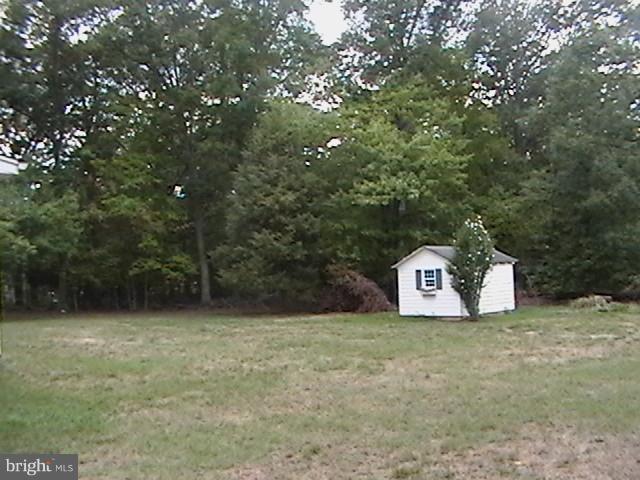 17107 Livingston Road Accokeek, MD 20607 - Photo 4 of 22 a view of a tree with wooden fence