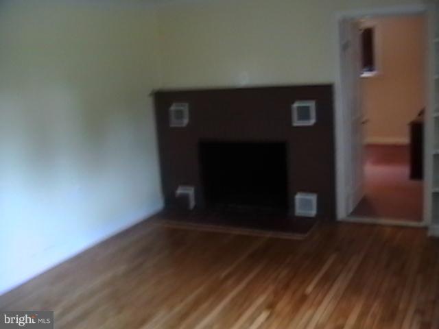 17107 Livingston Road Accokeek, MD 20607 - Photo 5 of 22 a view of a hallway with wooden floor