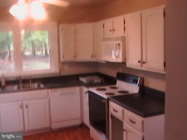 17107 Livingston Road Accokeek, MD 20607 - Photo 7 of 22 a kitchen with stainless steel appliances granite countertop a sink stove and cabinets