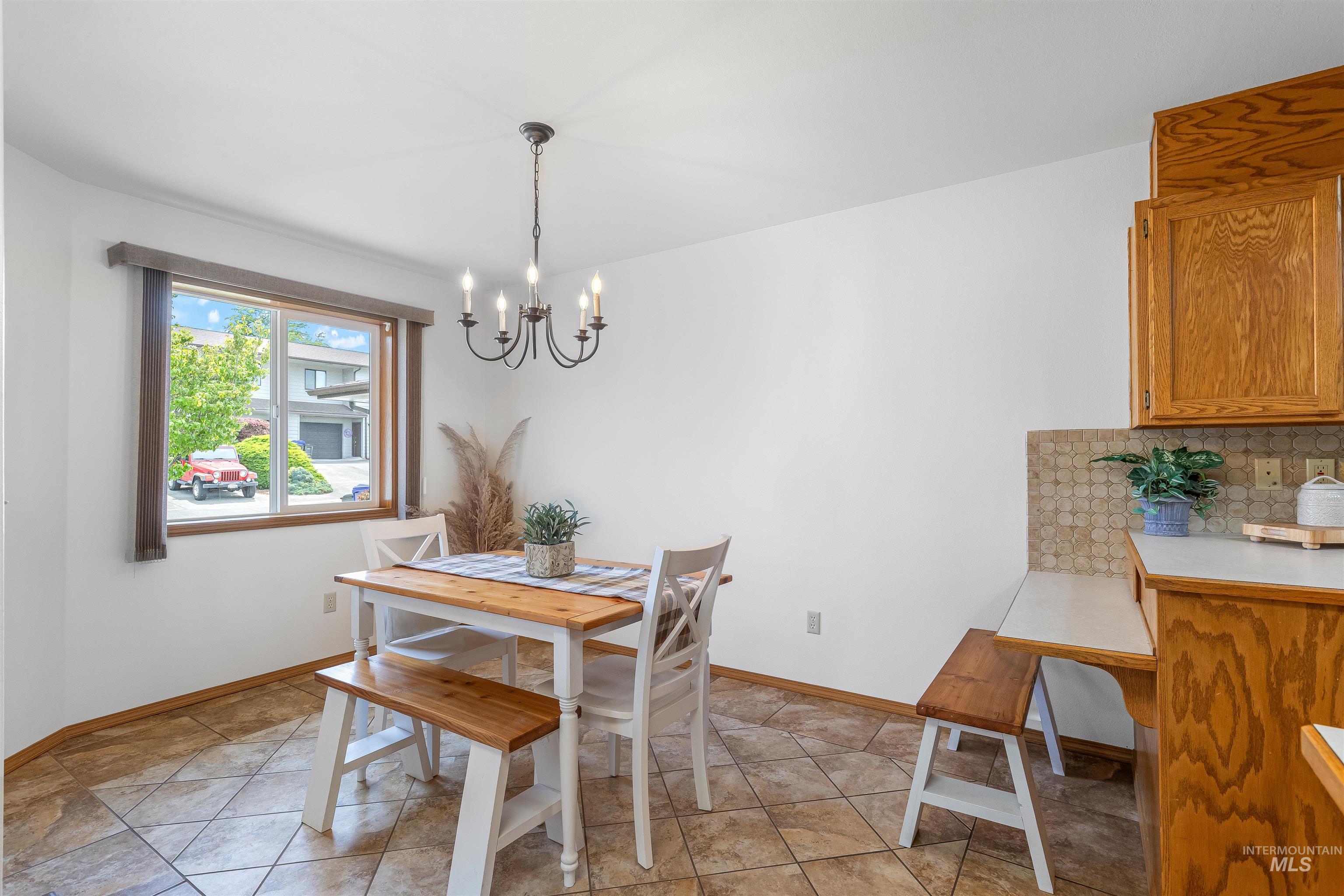 1409 29th Street Lewiston, ID 83501 - Photo 2 of 22 Dining area featuring a chandelier and light tile patterned flooring