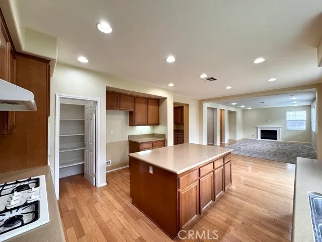 a large kitchen with kitchen island a sink counter space and stainless steel appliances