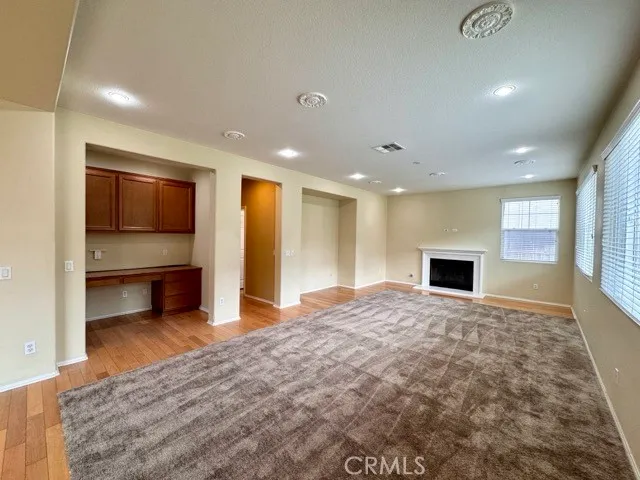 a view of kitchen and kitchen with sink refrigerator
