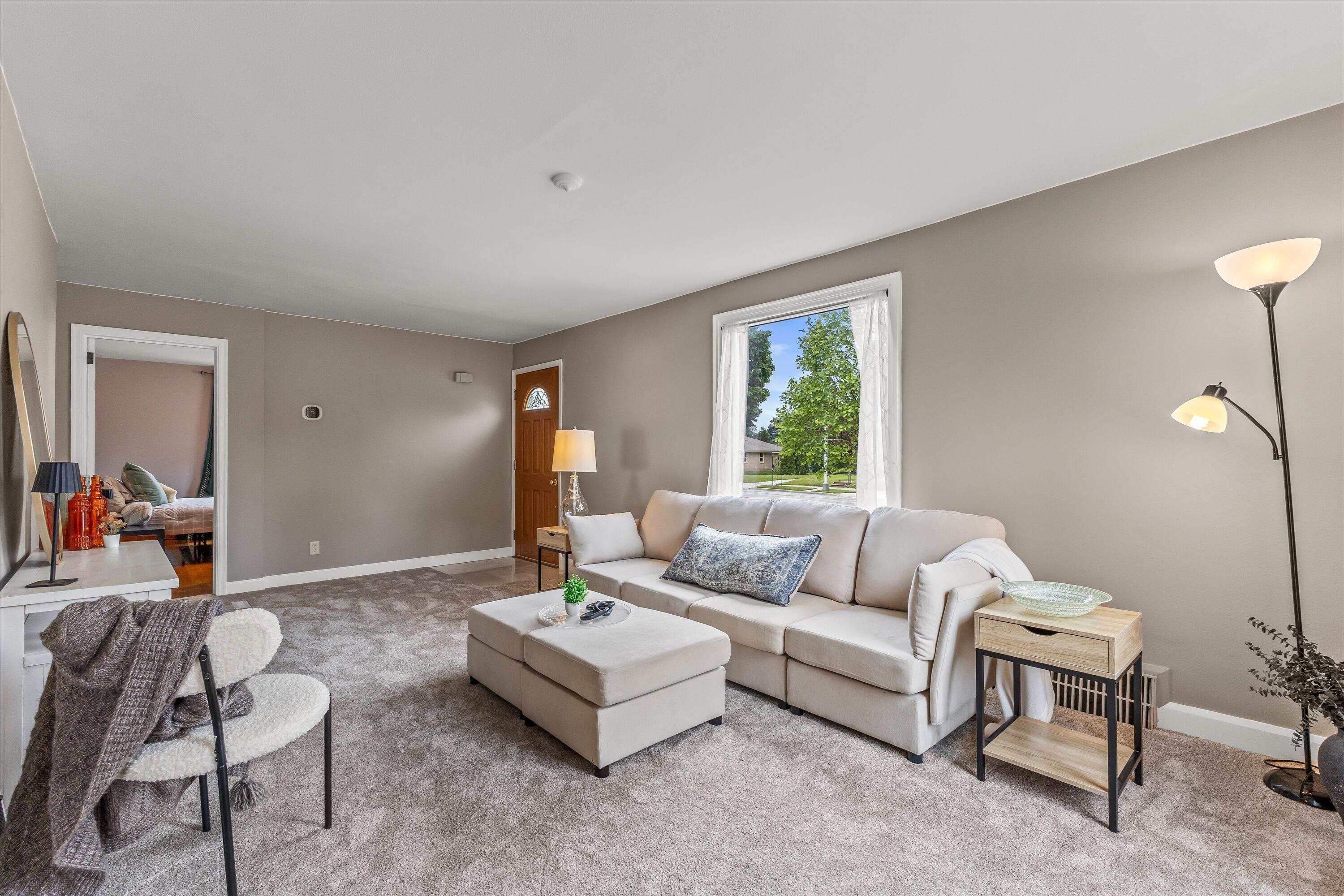 2925 North Main Street Racine, WI 53402 - Photo 6 of 23 Filled with natural light and generous living space, this welcoming room provides the perfect setting for relaxing, gathering, or entertaining.