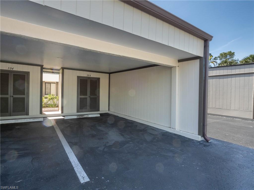 5857 Rattlesnake Hamm Road, Unit 204 Naples, FL 34113 - Photo 14 of 15 an empty room with windows