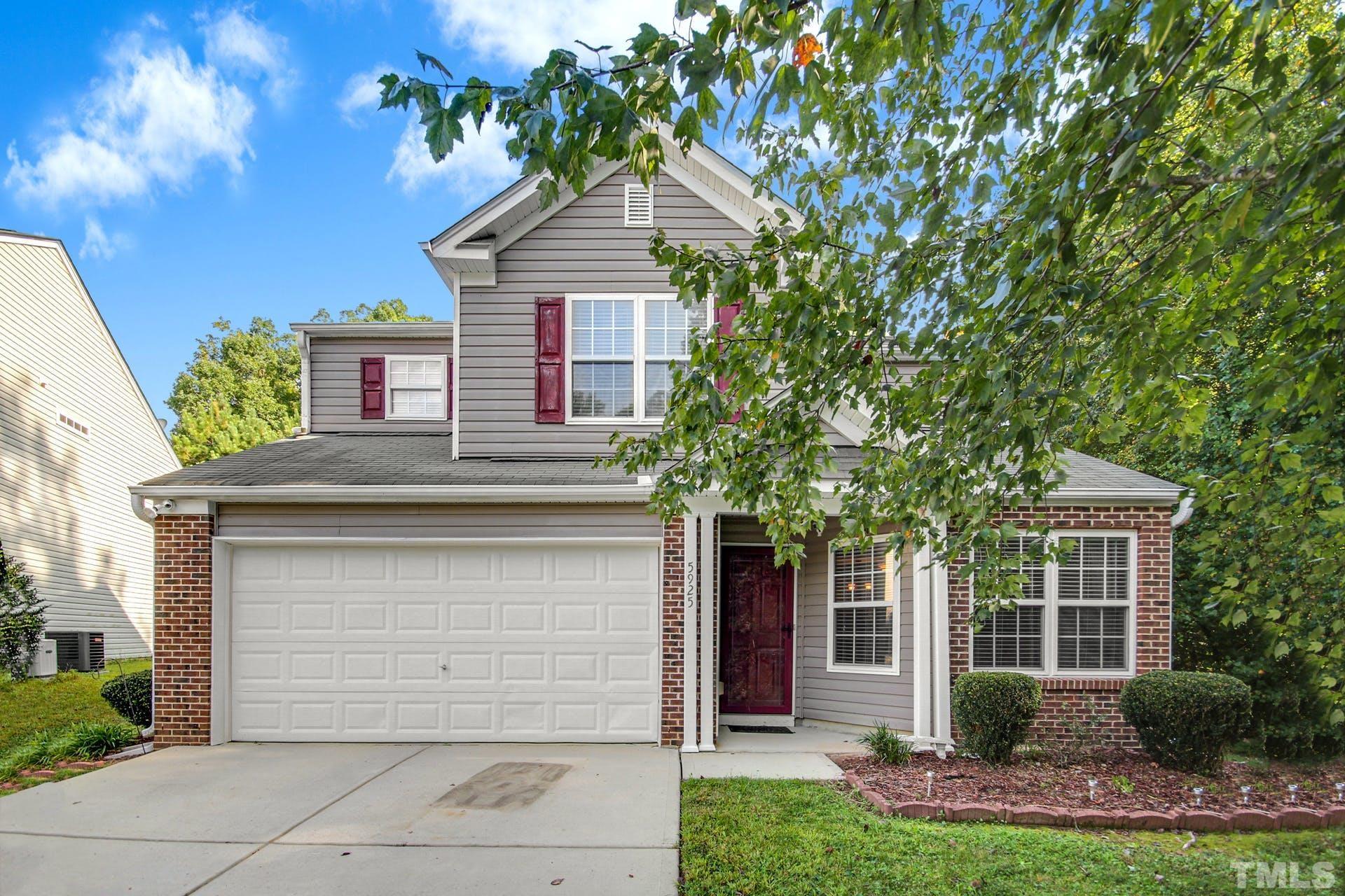 5925 Wessel Way Raleigh, NC 27610 - Photo 1 of 29 a front view of a house with a garden