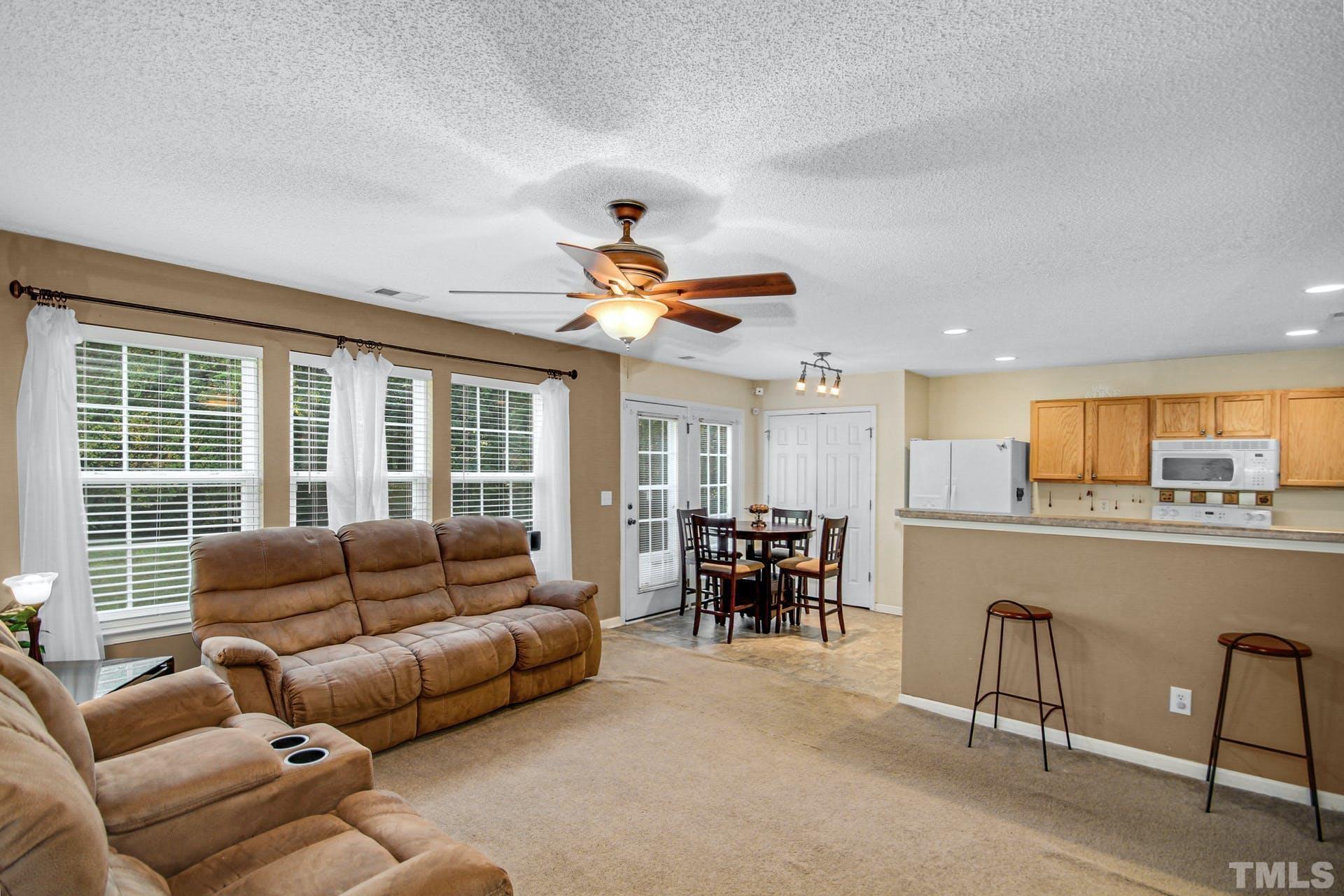 5925 Wessel Way Raleigh, NC 27610 - Photo 12 of 29 a living room with furniture and a large window
