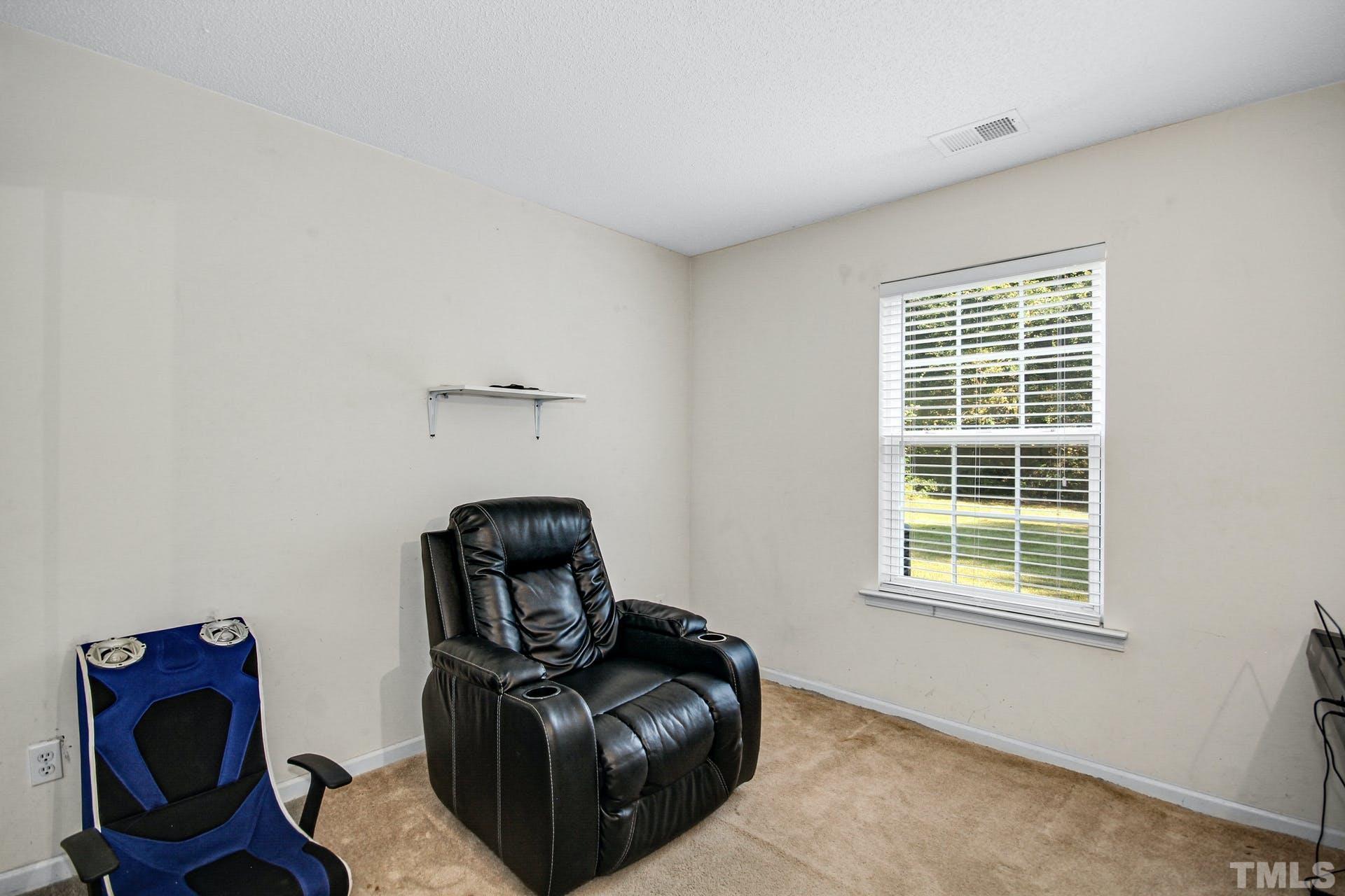 5925 Wessel Way Raleigh, NC 27610 - Photo 14 of 29 a living room with furniture and a window