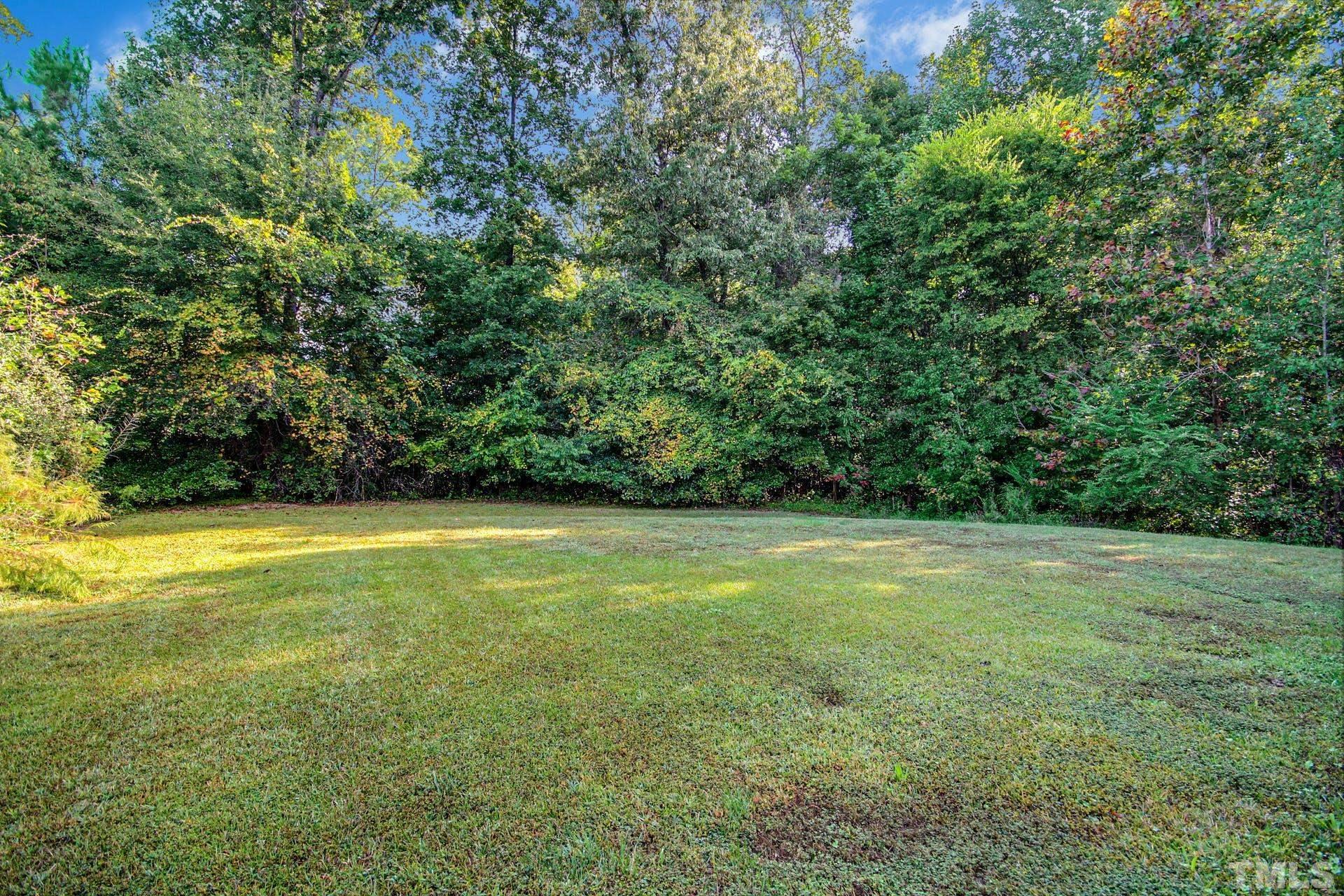 5925 Wessel Way Raleigh, NC 27610 - Photo 26 of 29 a view of a field with an trees