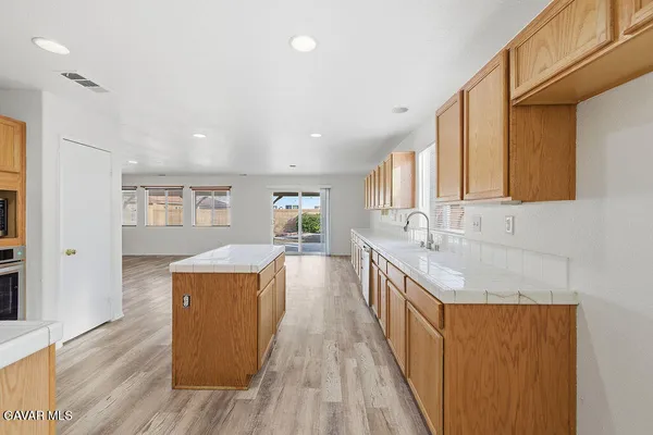 an empty room with windows and natural light