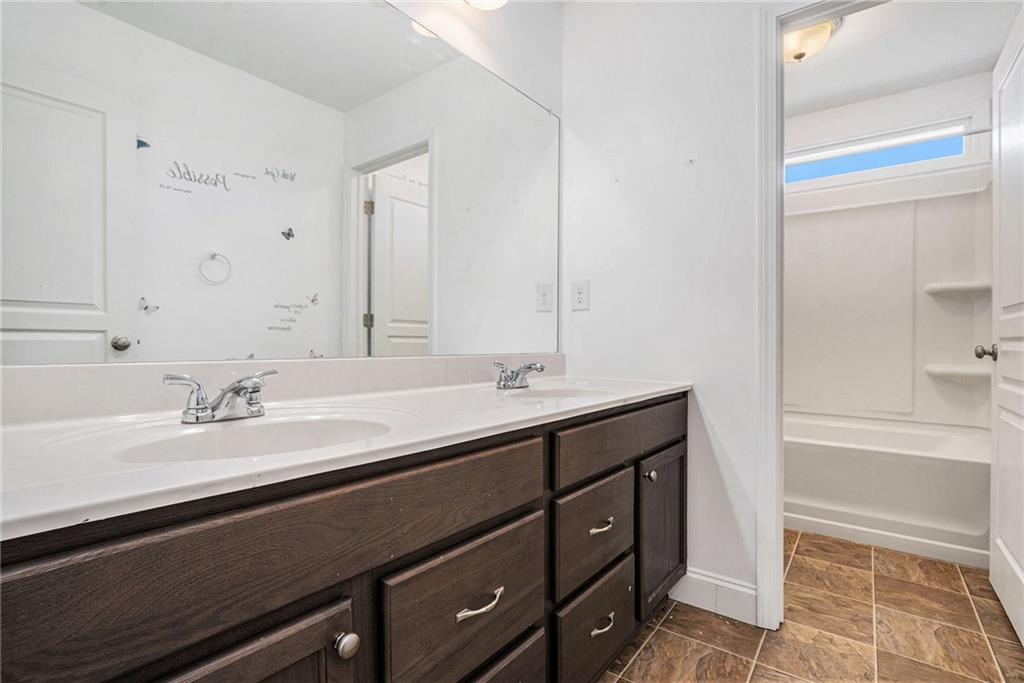 115 Floating Leaf Way Dallas, GA 30132 - Photo 28 of 47 a bathroom with a sink double vanity and a mirror