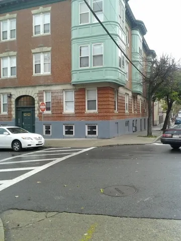 a view of a car park in front of a building