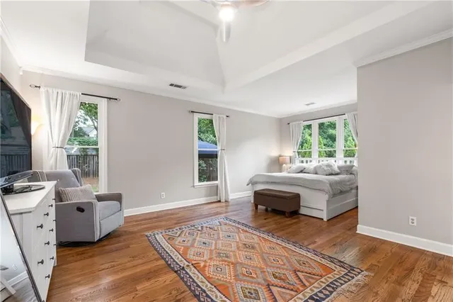 a bedroom with furniture and a window