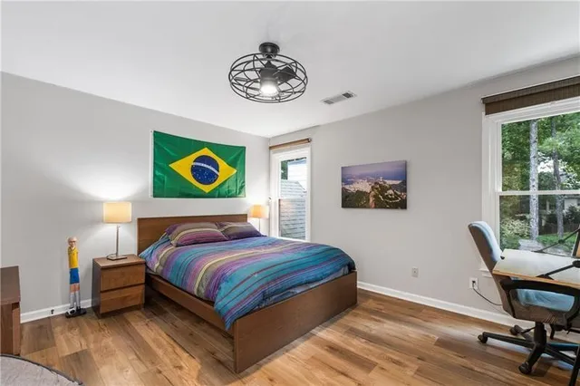 a bedroom with a bed and a table in it