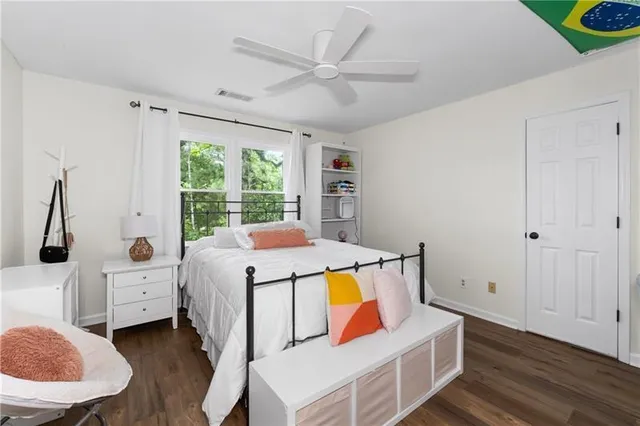 a bedroom with furniture and a window