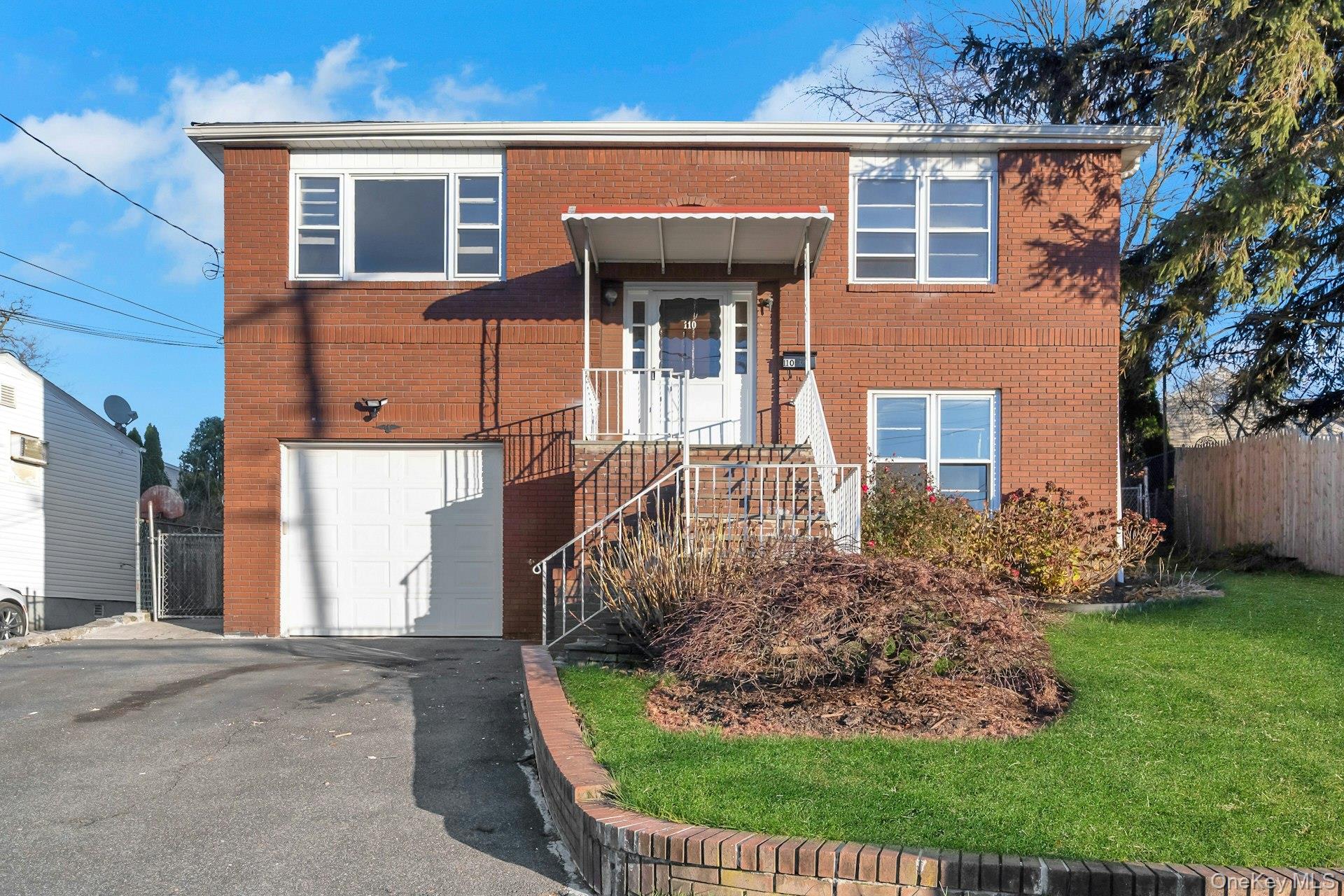 110 Beverly Road Yonkers, NY 10710 - Photo 1 of 1 front view of a house with a yard