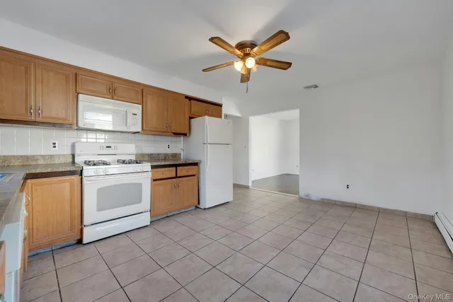 a kitchen with a stove cabinets and a sink