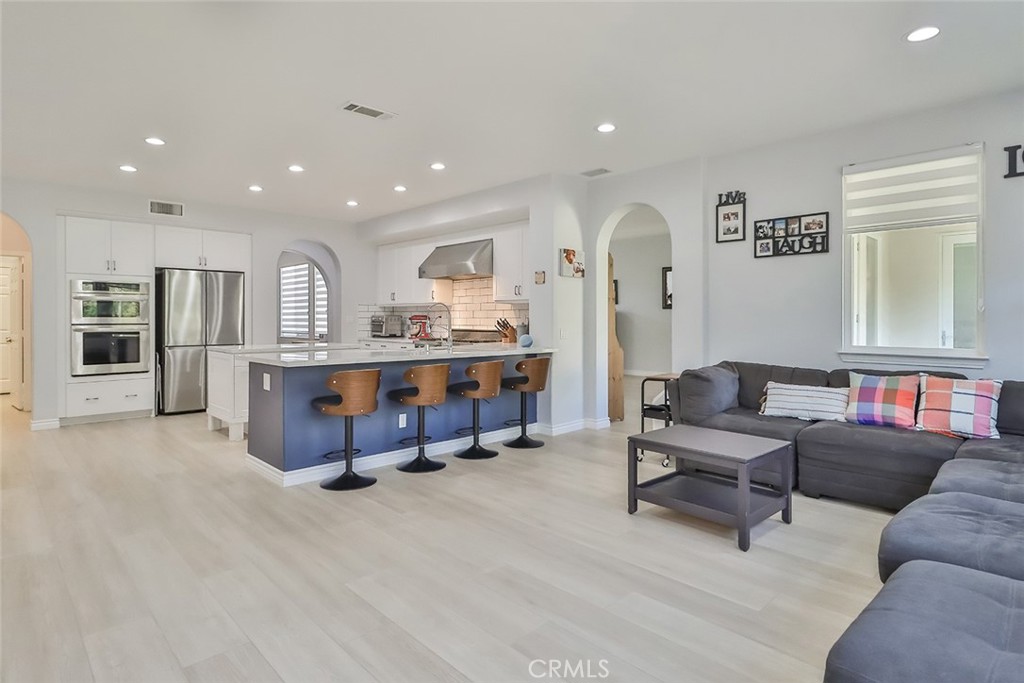 5421 Moonshadow Street Simi Valley, CA 93063 - Photo 14 of 56 a living room with furniture and a table