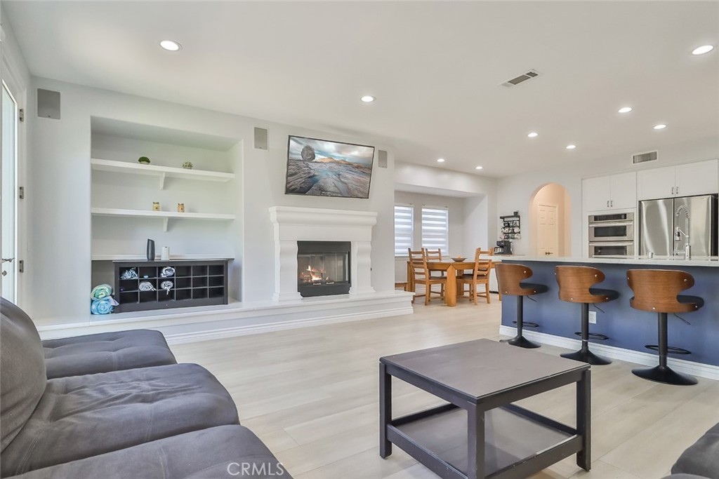 5421 Moonshadow Street Simi Valley, CA 93063 - Photo 15 of 56 a living room with furniture and a fireplace