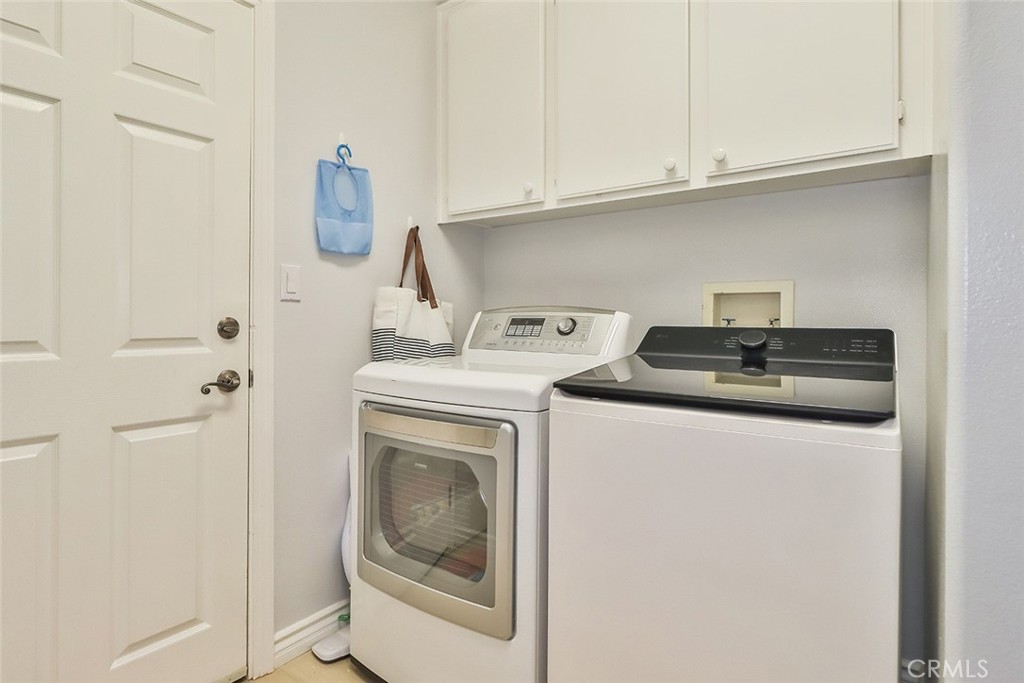 5421 Moonshadow Street Simi Valley, CA 93063 - Photo 26 of 56 a utility room with dryer and washer