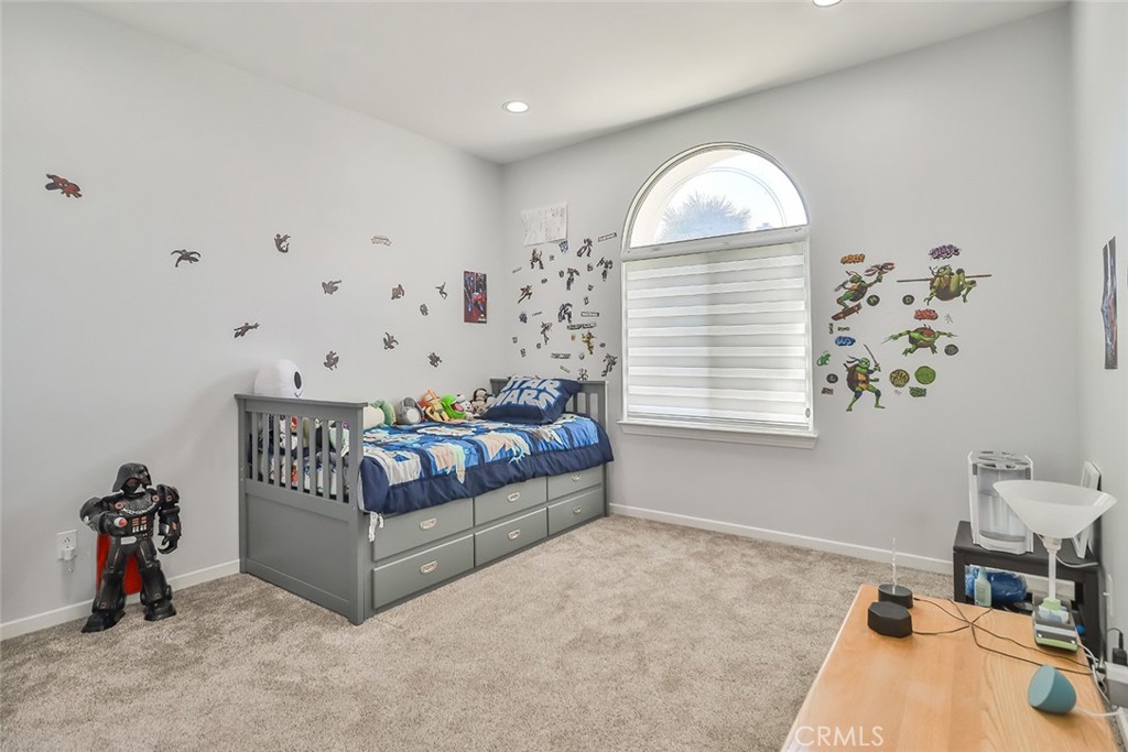 5421 Moonshadow Street Simi Valley, CA 93063 - Photo 30 of 56 a bedroom with furniture and a window