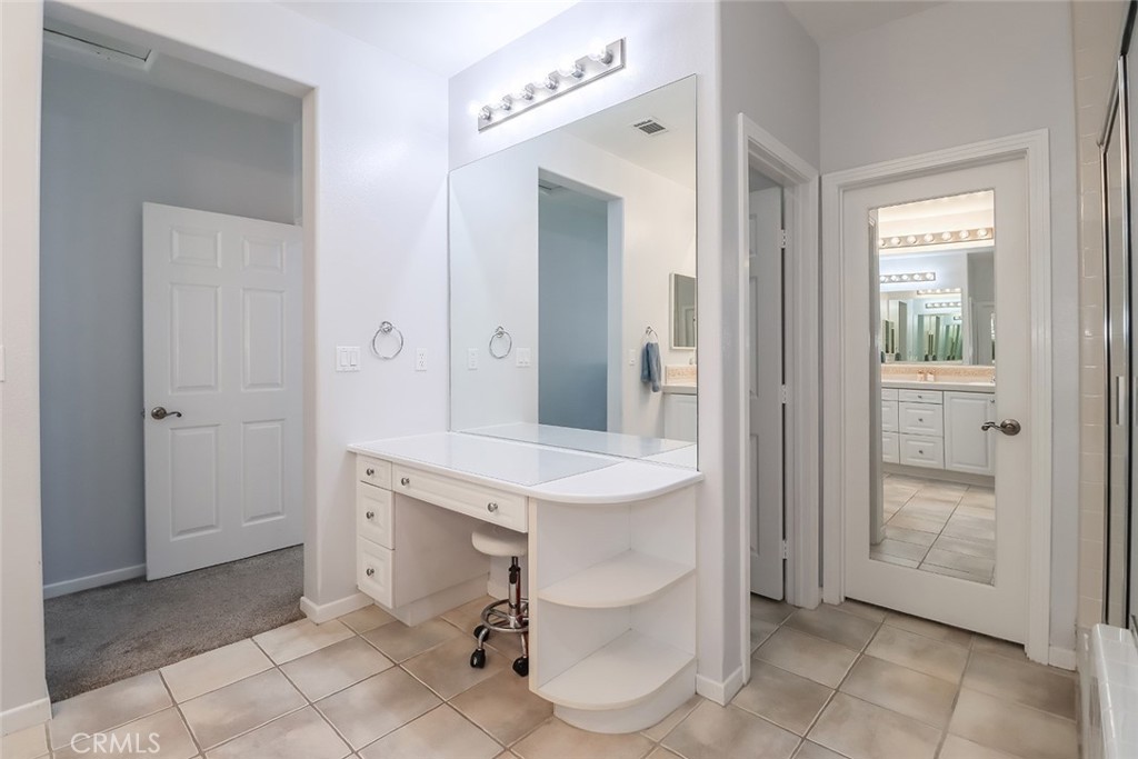 5421 Moonshadow Street Simi Valley, CA 93063 - Photo 41 of 56 a spacious bathroom with a sink a mirror and a shower