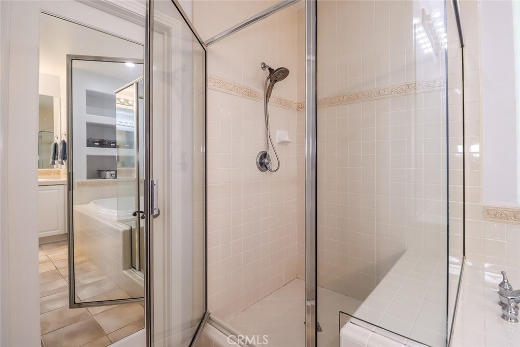 5421 Moonshadow Street Simi Valley, CA 93063 - Photo 43 of 56 a bathroom with a glass shower door